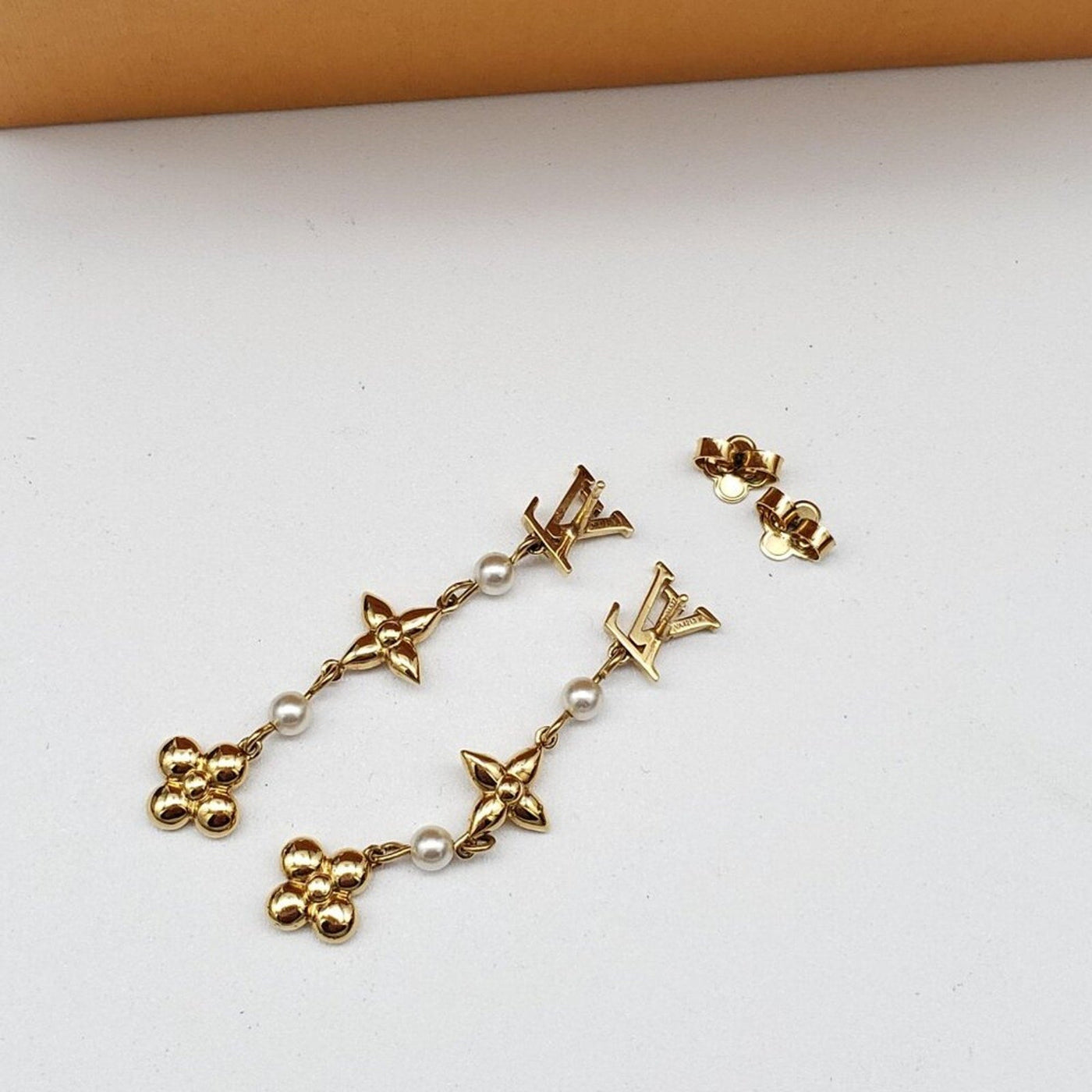 Louis Vuitton Metal Pearl Louisa Drop Earrings in gold - tone metal w/faux pearl - Luxury Cheaper LLC